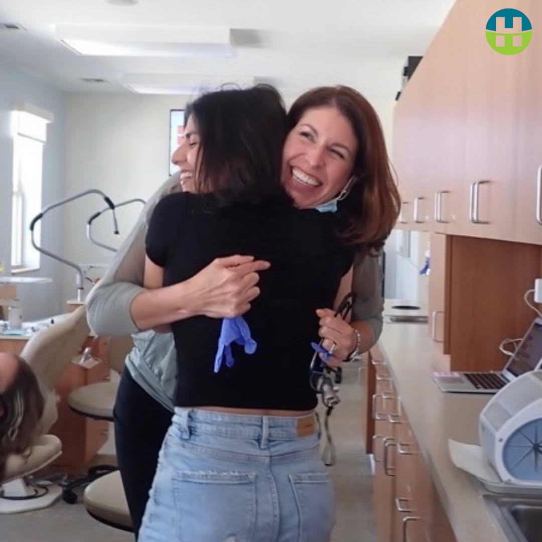 r. Allison Hamada hugging a patient after successful teeth grinding treatment at Hamada Orthodontics in Metairie, Louisiana