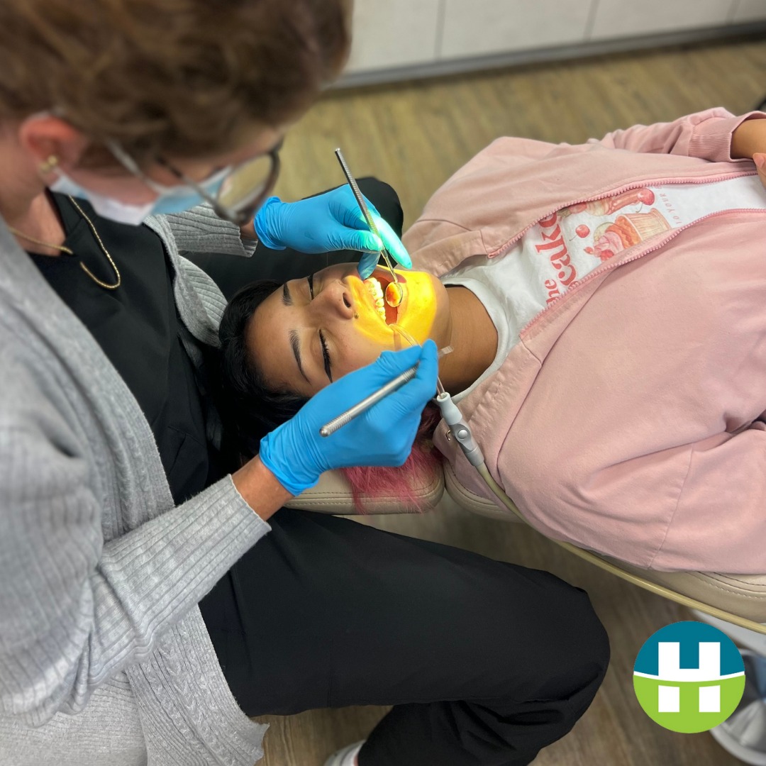 Orthodontist performing an airway and palate examination on a young patient at Hamada Orthodontics—evaluating for mouth breathing and sleep-related issues in the New Orleans area.