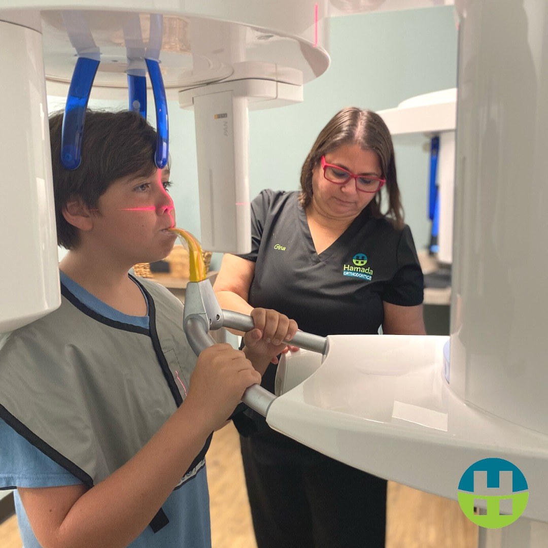 3D Digital Imaging for Airway Orthodontics in New Orleans Hamada Orthodontics - Hamada Orthodontics A young patient receiving 3D digital imaging at Hamada Orthodontics while a team member assists. This advanced imaging technology allows Dr. Hamada to evaluate airway structure, jaw development, and dental alignment as part of a comprehensive airway orthodontic evaluation in New Orleans.